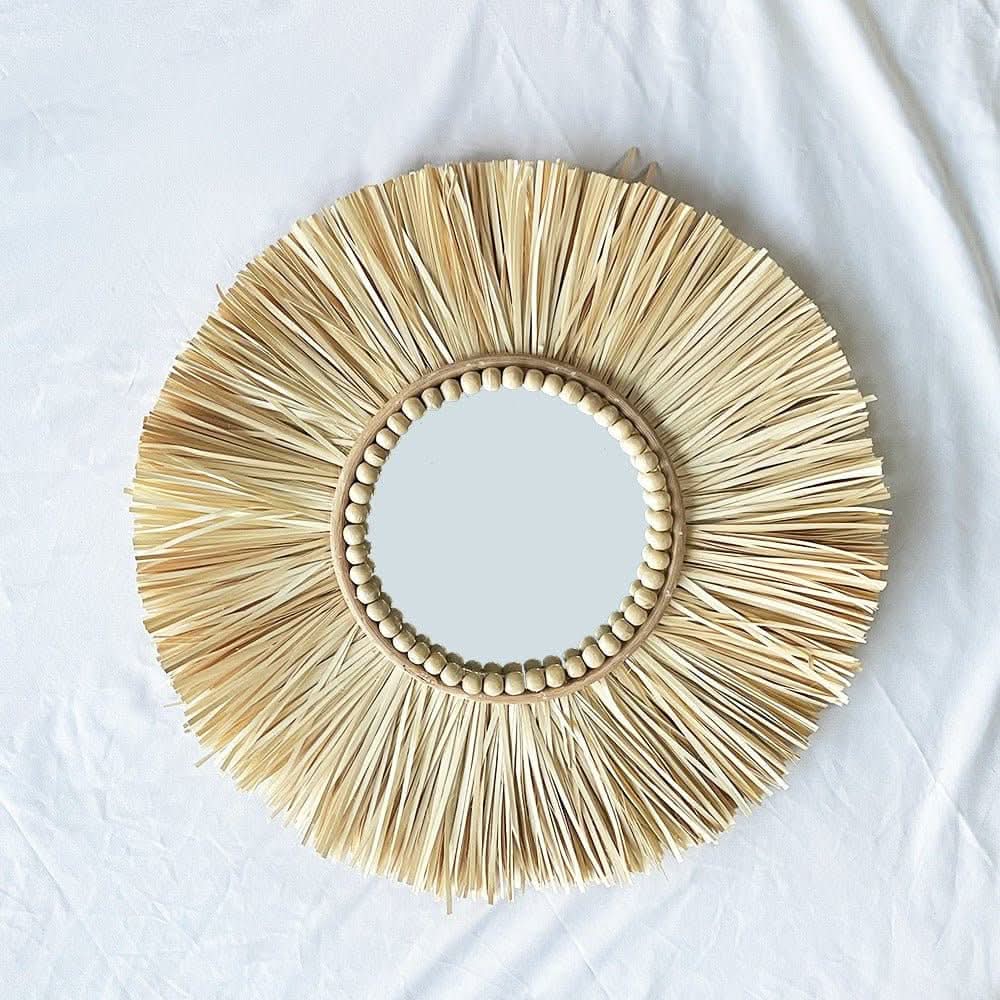 Natural rattan wall hanging handmade set with beaded detail and mirror, sunburst design.